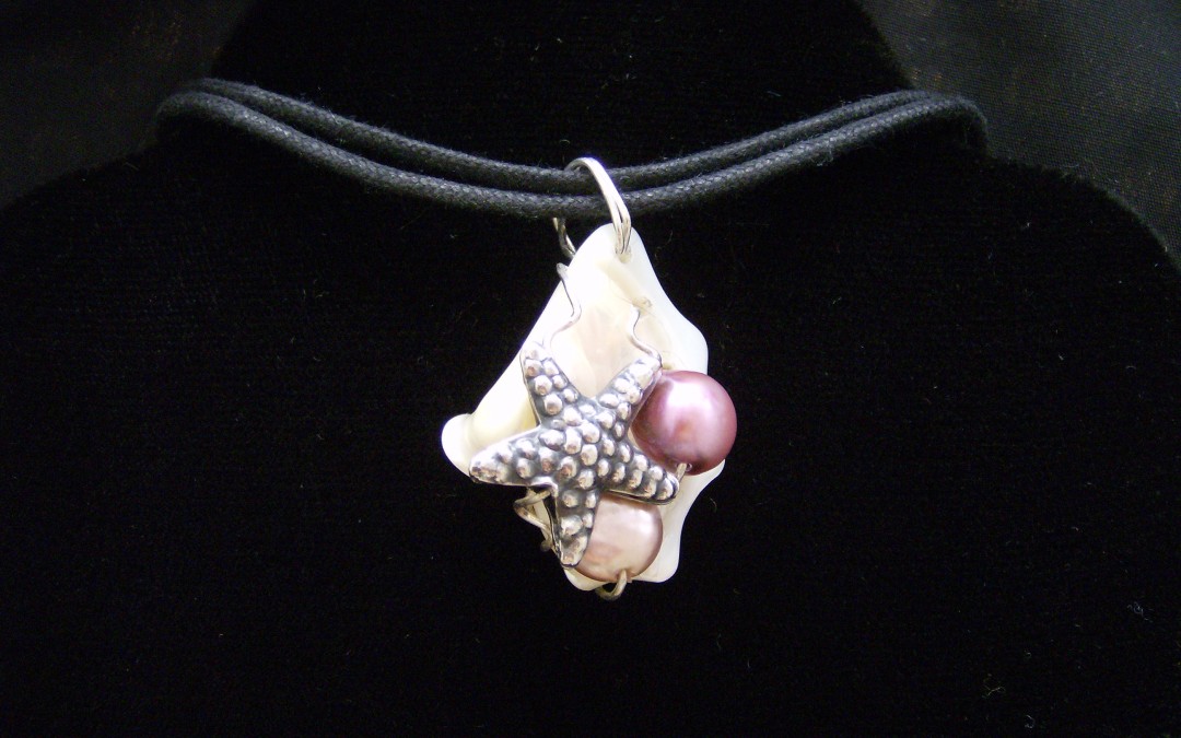 Sea Life, mother of pearl, fresh water pearl, pewter pendant on cotton cord adaptable to chain or omega. SOLD